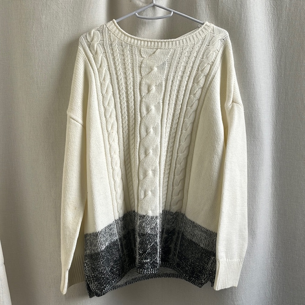 White sweater with bottom black print